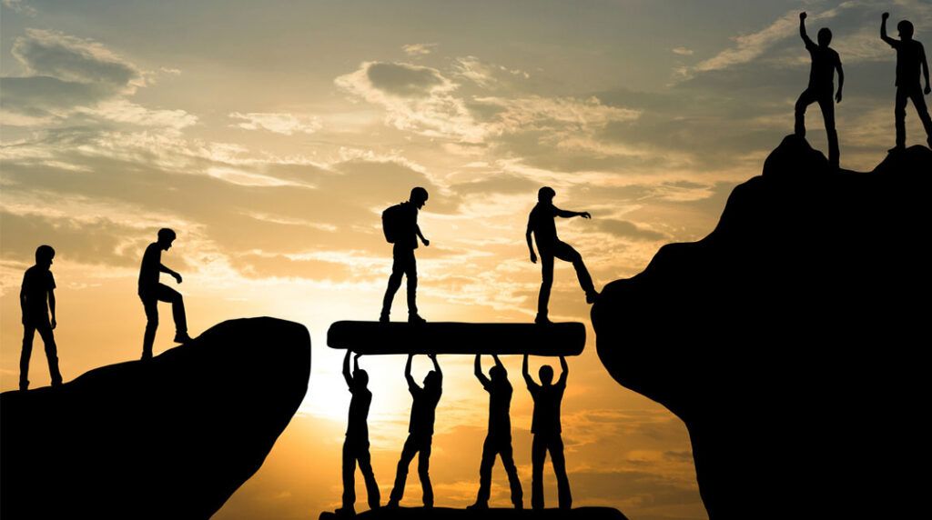 A group of people standing on top of rocks.